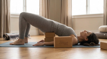 Load image into Gallery viewer, Woman using two four inch traditional rectangular blocks in supported bridge pose