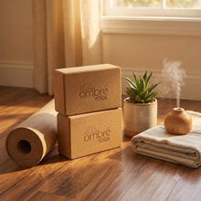 Load image into Gallery viewer, two four inch traditional rectangular cork yoga blocks next to a yoga mat and yoga blanket